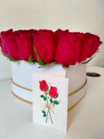 heart box of red roses