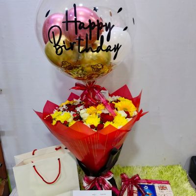 birthday flowers with balloon and chocolate